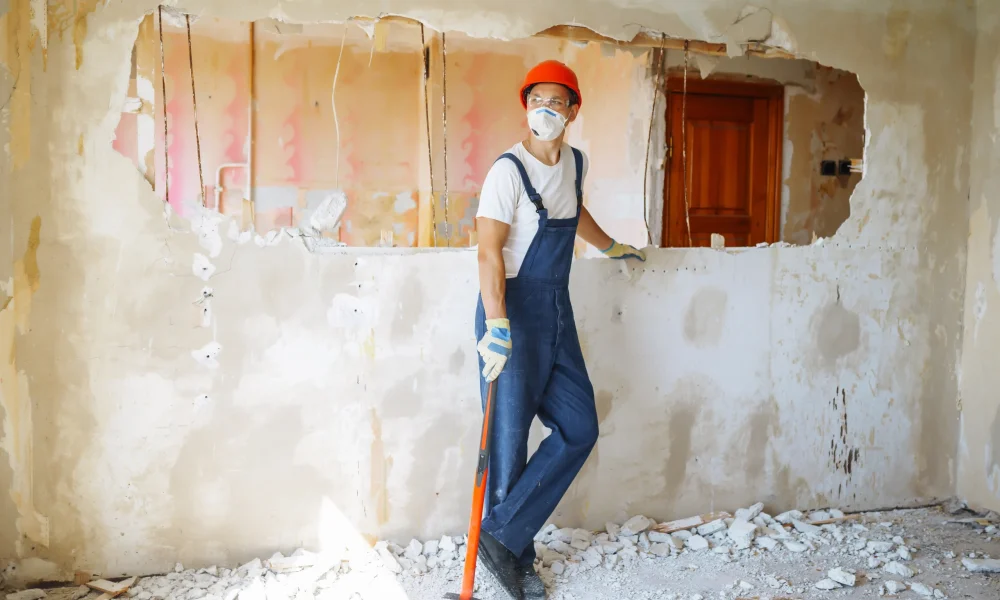 young-male-builder-in-hard-hat-holding-tools-apar-2025-03-09-21-10-32-utc